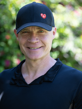 Load image into Gallery viewer, Black Trucker Hat with Heart + Rackets is a unique and eye-catching accessory that beautifully combines sporty aesthetics with a touch of emotion and symbolism.