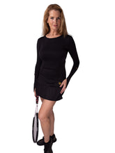Load image into Gallery viewer, Our "Long Sleeve Monroe Tennis Dress" offers a little more coverage around the chest and arms than our "Monroe Tennis Dress", yet delicately shows your feminine curves. The dress is fitted throughout the body, with a flirty ruffle at the hem. It's perfect for tennis, and yet elegant enough for drinks after your win.