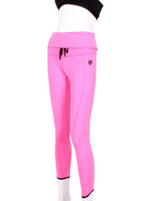 Load image into Gallery viewer, This is our limited edition rolled/high waist leggings in Pink. This piece has a silky soft and quick-drying. We make these in very small quantities - by design. Unique. Luxurious. Comfortable. Cool. Fun.