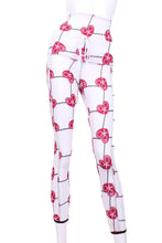 Load image into Gallery viewer, This is our limited edition roll down waist leggings in Raspberry Red Hearts & Net. This piece has a silky soft and quick-drying with a convenient back pocket for your tennis balls. We make these in very small quantities - by design. Unique. Luxurious. Comfortable. Cool. Fun.