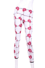 Load image into Gallery viewer, This is our limited edition roll down waist leggings in Raspberry Red Hearts & Net. This piece has a silky soft and quick-drying with a convenient back pocket for your tennis balls. We make these in very small quantities - by design. Unique. Luxurious. Comfortable. Cool. Fun.
