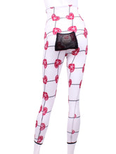 Load image into Gallery viewer, This is our limited edition roll down waist leggings in Raspberry Red Hearts & Net. This piece has a silky soft and quick-drying with a convenient back pocket for your tennis balls. We make these in very small quantities - by design. Unique. Luxurious. Comfortable. Cool. Fun.