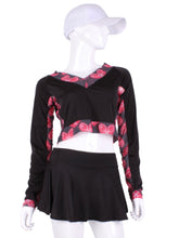 Load image into Gallery viewer, Black Vee Crop Top with Heart Mesh Trim. This vee neckline tops arm protection from the sun, but have mesh under the arm to keep you COOL while you play. These beautiful tops have the Heart + Rackets (trademarked) logo as the contrast. Designed very short to allow for access to the back pocket on my court to cocktails tennis dresses. Hand sewn in Los Angeles.