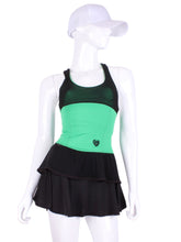 Load image into Gallery viewer, Ruffle Tank Tennis Top Green & Black Mesh. An elegant tennis ruffle top - silky soft - light - and quick-drying breathable fabric. Scoop neckline front and crossed back with two-needle cover stitch at each seam. Smooth binding finishes the edges with class. The most comfortable and feminine tennis top. These pieces run small for a more petite woman - under 5’8” - for the medium max 34 D