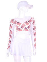Load image into Gallery viewer, Flag Vee Crop Top This vee neckline tops arm protection from the sun, but have mesh under the arm to keep you COOL while you play. These are the grey collection with airy black mesh contrast. Designed very short to allow for access to the back pocket on my court to cocktails tennis dresses.