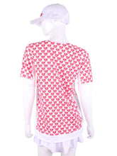 Load image into Gallery viewer, The very comfortable Baggy Vee Tee is so cool and easy to wear. For the lady that likes a little room when she plays - the feminine top is flowing in the air. This Mini Hearts on a white background has a white stripe down the sides, hem, collar, and cuff.