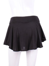 Load image into Gallery viewer, This limited Black LOVE "O" Skirt has shorties underneath and NO seams on the "O"!  It's cut like a doughnut to show and move beautifully as you play.  The fabric is uber soft and light - it dries quickly - and protects from UV rays too.  This skirt has a “nearly naked” feel about it.  The embroidery Heart is Red + Rackets and Ball Black to match the mesh.  Sleek black thread on the binding.