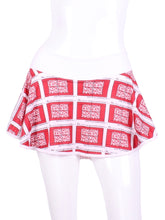 Load image into Gallery viewer, This gorgeous mini heart on white LOVE "O" Skirt has shorties underneath and NO seams on the "O"! It's cut like a doughnut to show and move beautifully as you play. The fabric is uber soft and light - it dries quickly - and protects from UV rays too. This skirt has a “nearly naked” feel about it.