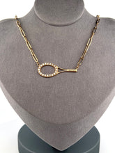 Load image into Gallery viewer, This luxuries necklace has a horizontal BIG gold tennis racket with diamonds.   With the dainty and very fancy shiny gold chain.   This racket design is exclusively mine and hand crafted by a team in downtown Los Angeles.
