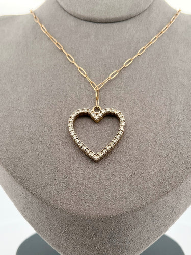 This luxurious necklace features a 1 inch gold heart covered in diamonds totalling over 1 karat.   Displays beautifully on an elegant solid gold paper clip chain. By LOVE LOVE TENNIS 