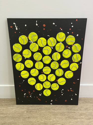 The Green Tennis Balls in Heart Shape Wall Art On Black is a visually striking and unique piece of artwork that combines sports imagery with a touch of romance