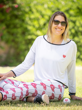 Load image into Gallery viewer, The Long Sleeve Baggy White Top is a cutting-edge fusion of style and functionality, embodying the essence of tennis fashion with a contemporary twist.
