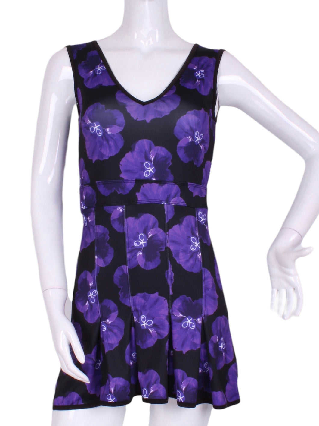 The Angelina Dress is modern yet classy.  This style is in our very limited Purple Pansy print, with a flattering v-neck neckline.  This soft, silky, and sexy tennis dress has an empire waist and a feminine skirt.