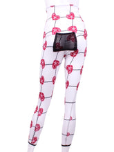 Load image into Gallery viewer, This is our limited edition roll down waist leggings in Raspberry Red Hearts &amp; Net.  This piece has a silky soft and quick-drying with a convenient back pocket for your tennis balls.  We make these in very small quantities - by design.  Unique.  Luxurious.  Comfortable.  Cool.  Fun.
