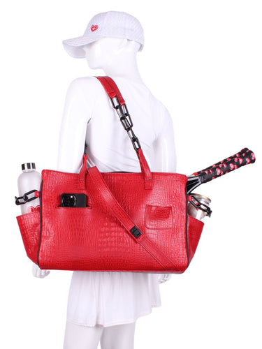 The Long Tennis Tote in Bright Red Vegan Alligator is our stylish, sexy and functional tennis bag designed to carry all your essentials for the game. 