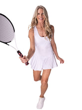 Load image into Gallery viewer, The Sandra Dee Dress offers a playful, fun, and very flirty look. Our dress is fitted, and flares out at the skirt. It is perfect for tennis, running and golf (with our Leg Lengthening Leggings), and of course, a trip to your after-court party with your friends. It was designed for confident women like you!
