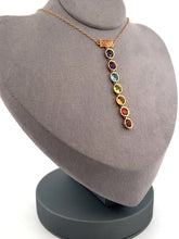 Load and play video in Gallery viewer, Elegant and timeless BLiSS by Adeline custom designed 7 Chakra necklace. The 4mm stones are:  Violet: Iolite Purple: Amethyst Blue: Aqua Marine Green: Peridot Yellow: Citrine Orange: Orange Sapphire Red: Garnet
