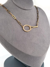 Load and play video in Gallery viewer, This luxuries necklace has a horizontal BIG gold tennis racket with diamonds.   With the dainty and very fancy shiny gold chain.   This racket design is exclusively mine and hand crafted by a team in downtown Los Angeles.
