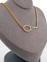 Load and play video in Gallery viewer, This luxuries necklace has a horizontal BIG gold tennis racket with diamonds.   With the dainty and very fancy shiny gold chain.   This racket design is exclusively mine and hand crafted by a team in downtown Los Angeles.
