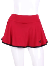 Load image into Gallery viewer, The bottom of the skirt is finished with binding - with two needle cover stitch - this makes it look like a piece of art.  My masterpiece.  As with all of my designs - cool machine wash - and it hangs dry super soft - no need to tumble it.  For the busy and elegant tennis woman.  This limited edition collection has a black heart (black rackets) on the red skirt and the red heart (black rackets) on the black skirt.
