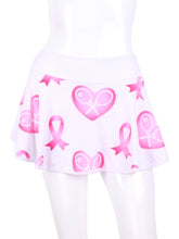 Load image into Gallery viewer, This gorgeous Pink Breast Cancer Awareness and Rackets on white LOVE &quot;O&quot; Skirt has shorties underneath and NO seams on the &quot;O&quot;!  It&#39;s cut like a doughnut to show and move beautifully as you play.  The fabric is uber soft and light - it dries quickly - and protects from UV rays too.  This skirt has a “nearly naked” feel about it.
