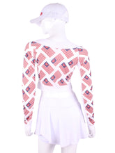 Load image into Gallery viewer, Flag Vee Crop Top This vee neckline tops arm protection from the sun, but have mesh under the arm to keep you COOL while you play. These are the grey collection with airy black mesh contrast. Designed very short to allow for access to the back pocket on my court to cocktails tennis dresses.
